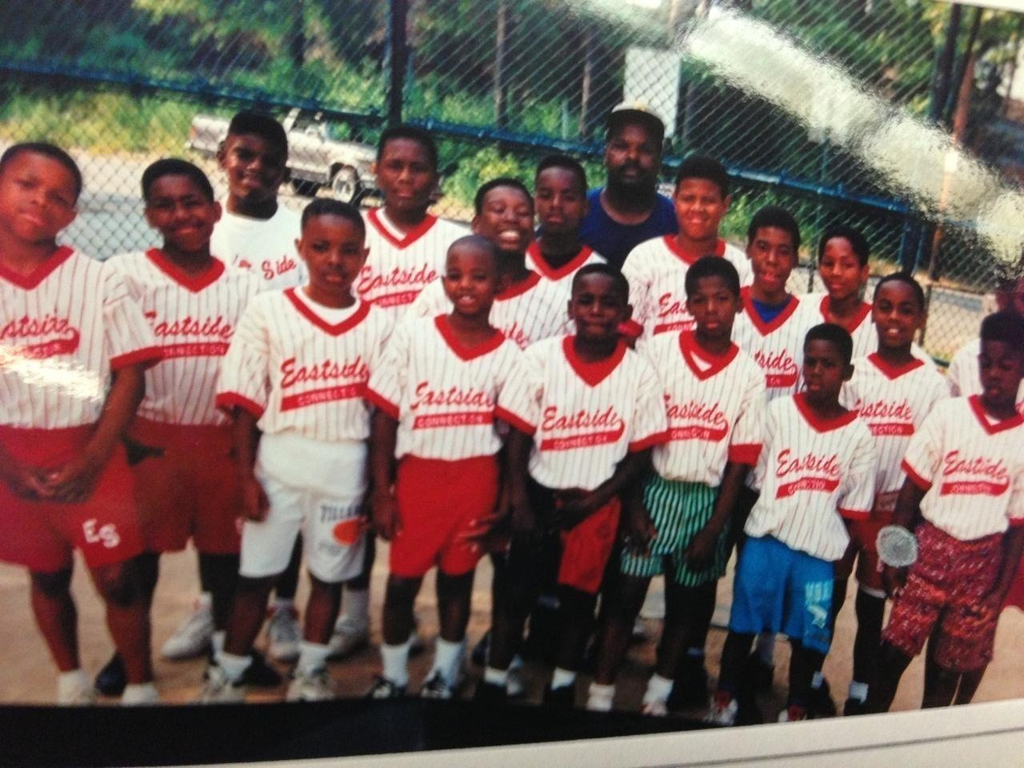 picture of Eastside Connection Little League Team with boys in red and white "Eastside" baseball jerseys 